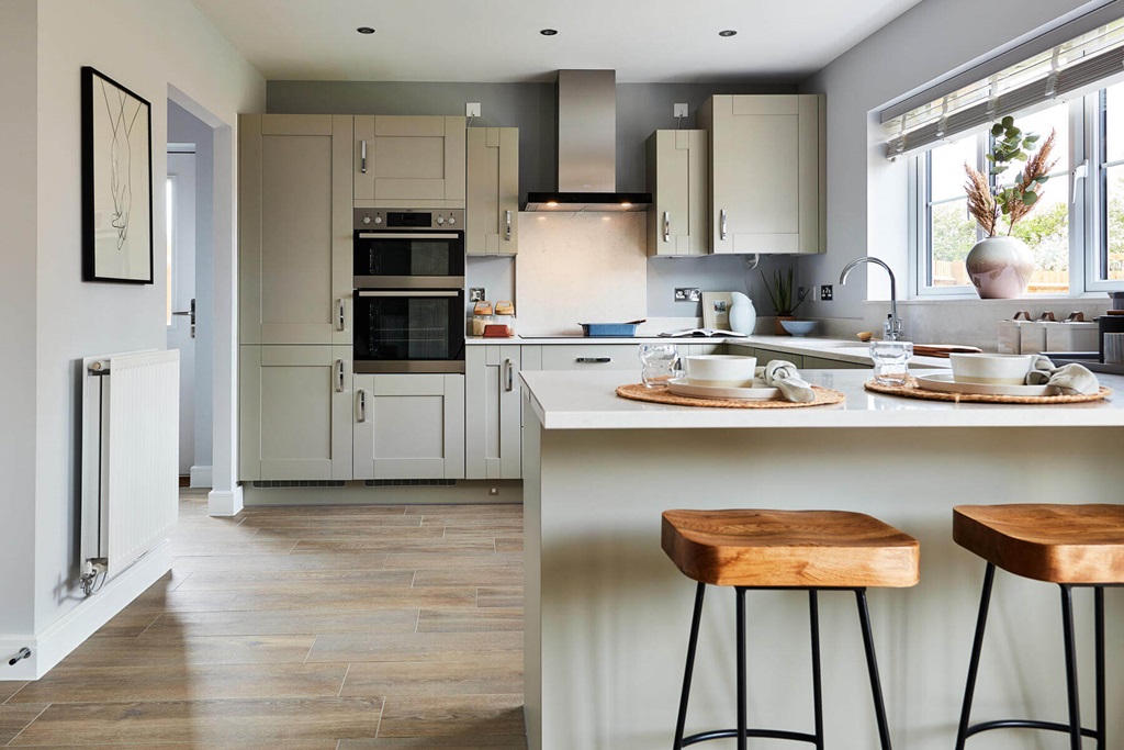 Property 3 of 12. The Kitchen Features A Breakfast Bar, Creating A Sociable Space For The Family