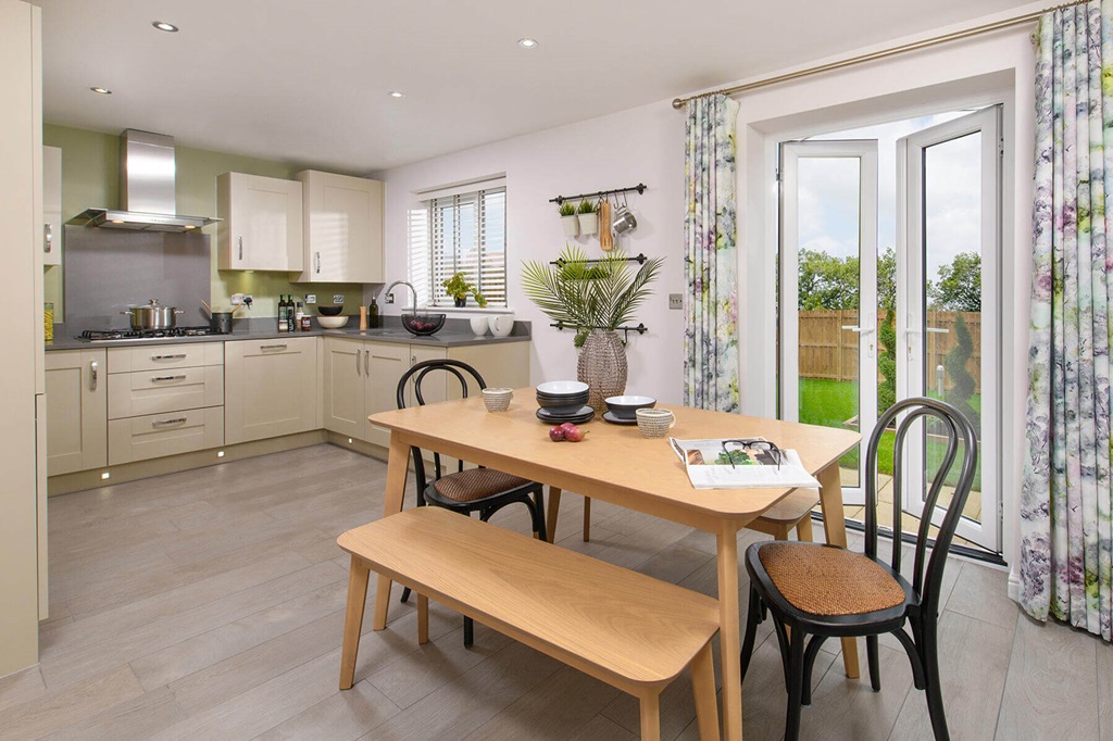 Property 2 of 10. An Open Plan Kitchen And Dining Area Leads Through Double Doors To The Garden