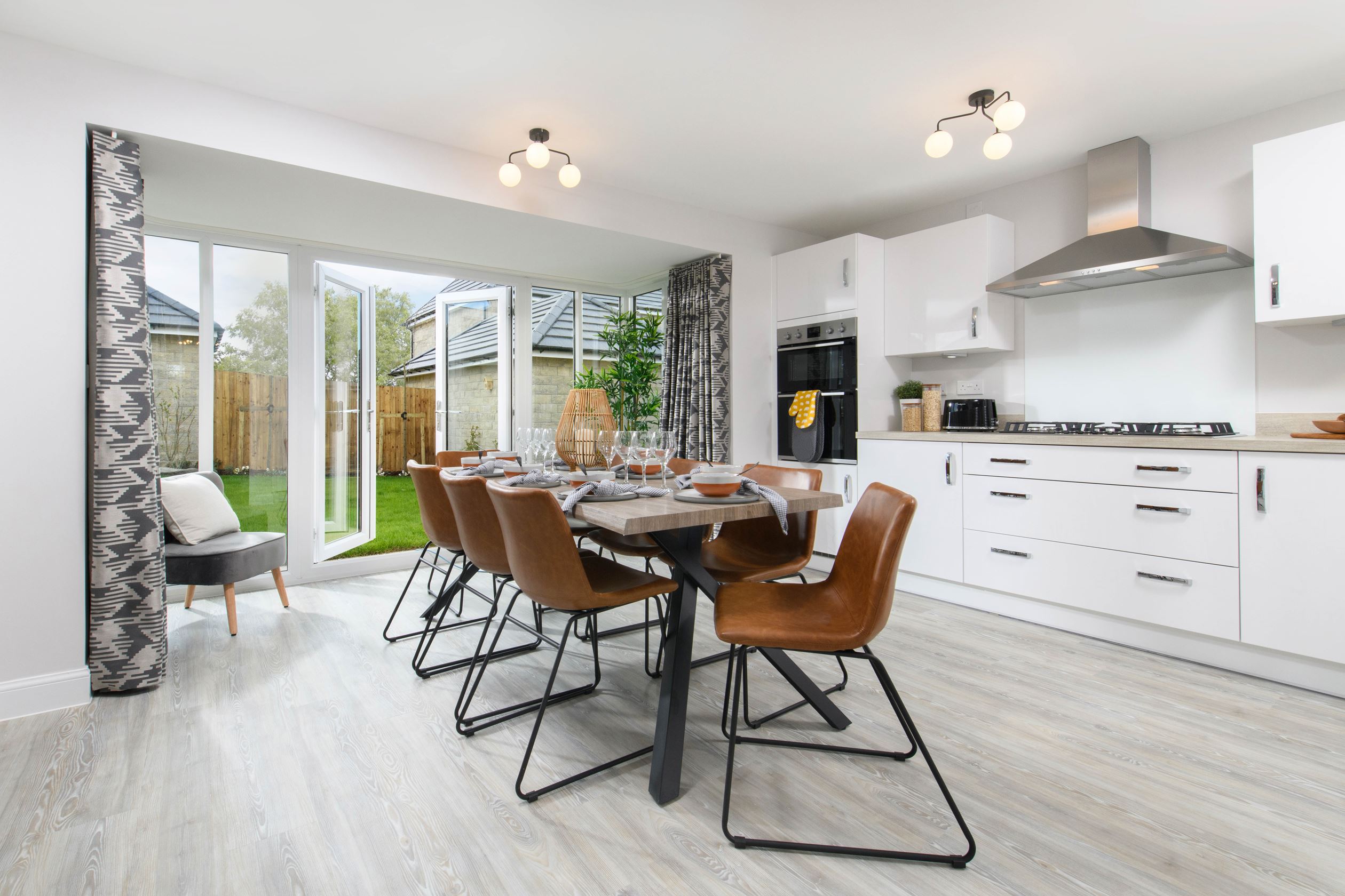 Property 1 of 10. Open-Plan Kitchen/Dining Area With Glazed Bay Leading Onto Garden - Millford Style Home