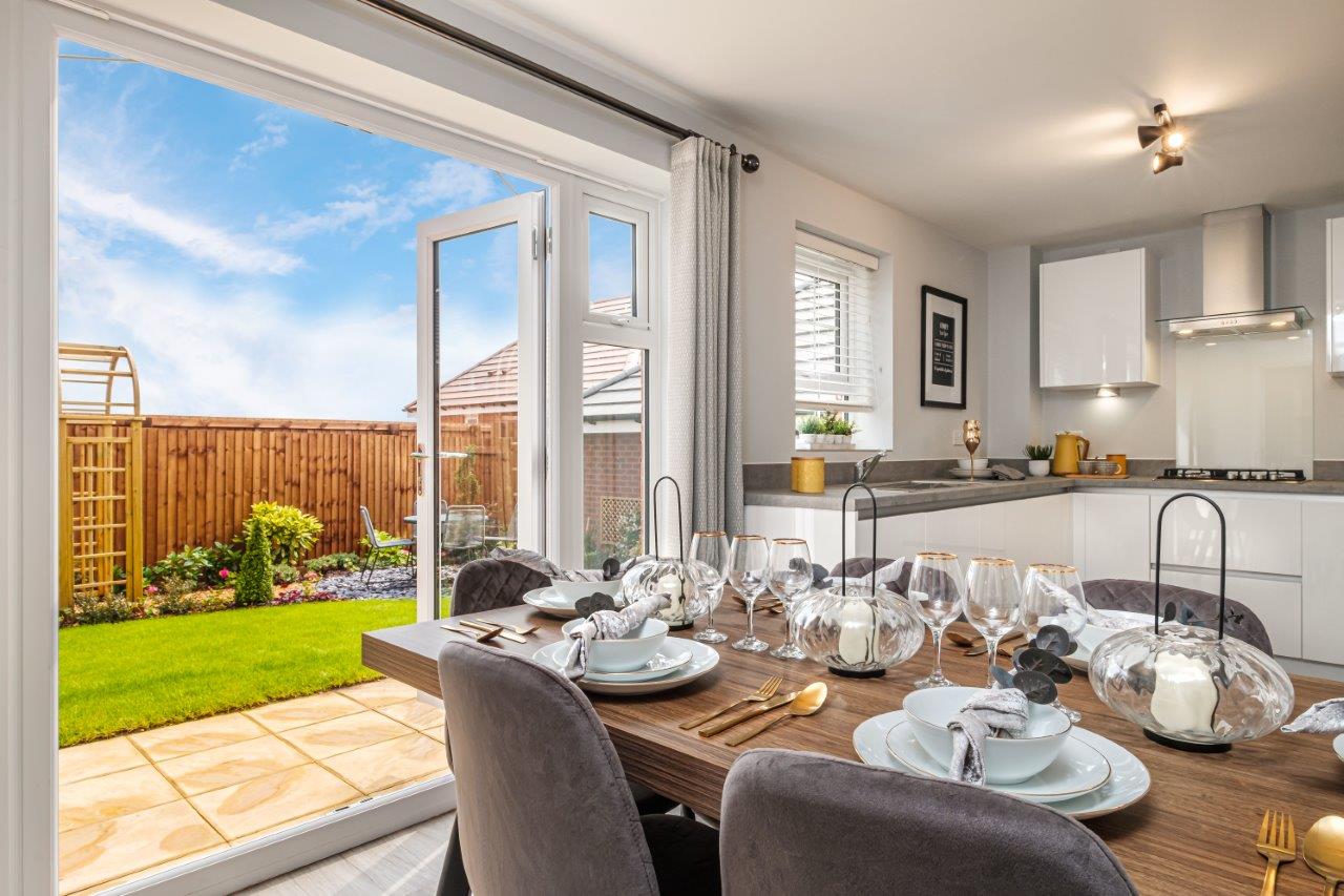 Property 1 of 8. Photo Of A Kitchen Diner With Open French Doors To A Landscaped Garden
