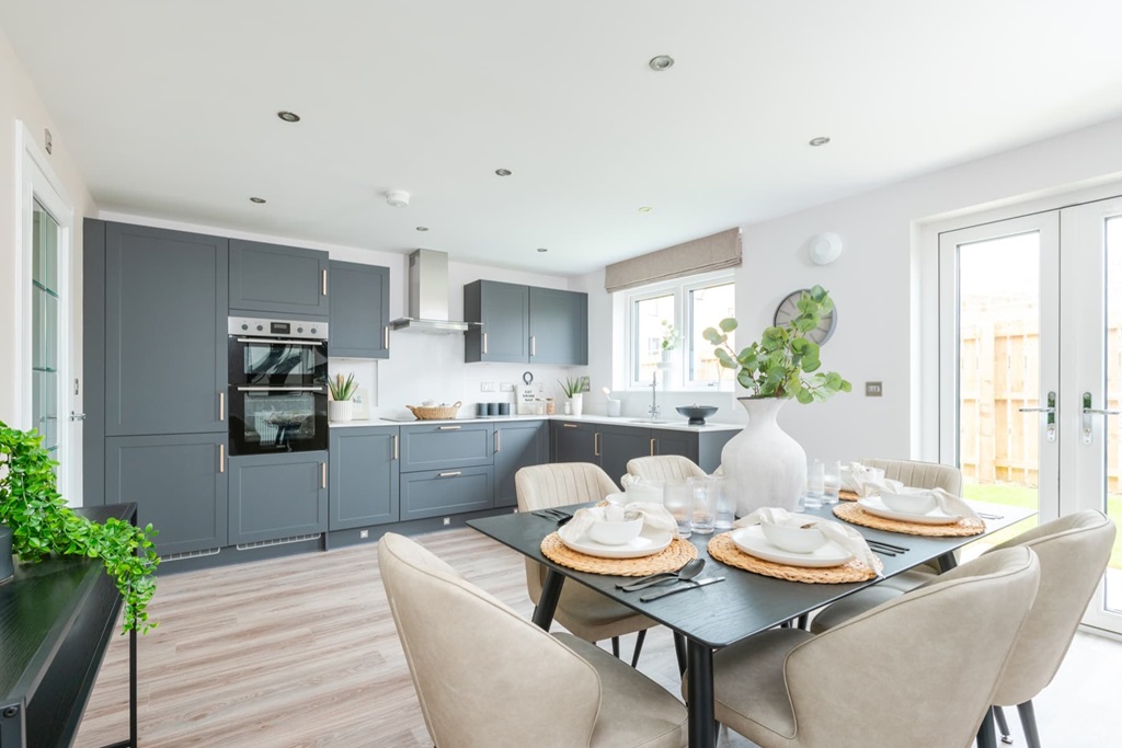 A Spacious Kitchen And Dining Area With French Doors To The Rear Garden